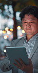 Online, night and Asian man on tablet in city for communication, typing email and networking. Professional, corporate and business person on digital tech for contact, website and transport service
