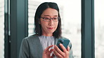 Asian businesswoman, phone or texting in office for news research, communication or networking. Browsing, chat or Japanese city planner on mobile for update notification, email review or negotiation