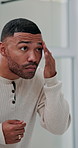 Skincare, bathroom and man with beard in apartment checking for acne, breakout or zit on face. Inspection, beauty and male person with facial hair pimples or blackheads for grooming routine at home.