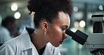 Scientist, woman and microscope in medical research for breakthrough, examination and experiment. Female doctor, solution and planning on technology for analysis testing, idea and hospital laboratory