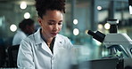 Scientist, woman and typing notes with laptop for chemistry, experiment or medical research. Laboratory, analysis and expert with liquid inspection for pharmaceutical or pathology study progress