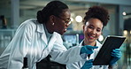 Scientist, women and tablet in lab with discussion, point and medical research for pharmaceutical development. People, partner and touchscreen with mentoring, vaccine and happy for study with app