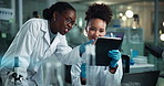 Scientist, women and tablet in lab with mentor, point and medical research for pharmaceutical development. People, partner and touchscreen with coaching, vaccine and discussion for study with app