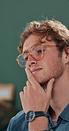 Thinking, research and glasses with business man in office for planning, idea and proposal. Reading, reflection and brainstorming with person in agency for solution, vision and review decision