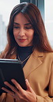 Tablet, mature and research with business woman in office for networking, online report and digital review. Brand consultant, social media manager and planning with person in agency for website