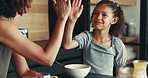 Mother, child and eating in home with high five for development, nutrition success and bonding. Happy family, woman and girl with celebration in kitchen for finished breakfast, support and motivation