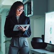 Graph, office and business woman on tablet for statistics, financial ...