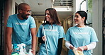 Charity, volunteer people and walking for cleaning in building with community service, planning schedule and supplies. NGO project, teamwork and talking for cleaner briefing and social responsibility