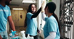 Charity, volunteer people and discussion for planning cleaning schedule, building cleanup or community service. NGO project, high five or collaboration in hallway for social responsibility or support
