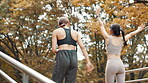Outdoor, fitness and women with high five, success and nature with exercise goals, win and energy. People, friends or runners in park, hand gesture or wellness with motivation, challenge or Japan