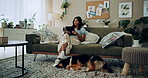 Tablet, relax and woman with dog in home for bonding, scroll social media and reading animal blog. Pet, digital technology and communication on sofa, thinking or Indian girl check online notification