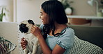 Happy woman, pug and play with dog in home for love, care and bonding in living room. Pet, smile and friends together on sofa for support, connection and Indian girl scratch cute animal in adoption