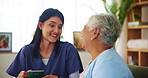 Happiness, senior woman and nurse for tea, break and conversation in retirement home for bonding. Female people, talking and relax for caregiver, elderly care and support with laughing, joke and chat