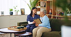 Assisted living, nostalgia or photograph with nurse and old woman on sofa in retirement home together. Loss, memory or sad with caregiver and senior patient in apartment for comfort or consoling