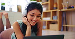 Laptop, girl and dancing with headphones in home for online entertainment, internet sound or audio playlist. Woman, tech and happy with streaming subscription, listening to music and relax on floor