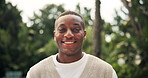 Outdoor, black man and face with smile for holiday, vacation and confidence with satisfaction. Nature, male person and happiness in portrait for weekend, travel adventure and positive with pride