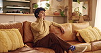 Phone call, talking and man on sofa in home for contact, online chatting and communication on weekend. Happy, living room and person on smartphone for social networking, connection and conversation