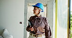 Architect, woman and walking with tablet at construction for inspection, project maintenance and progress. Mature, manager and check architecture with property development, demolition and renovation