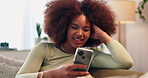 Happy, black woman or relax with phone on sofa for online entertainment, streaming or fun network at home. African, female person or user with smile or mobile smartphone on couch for app subscription