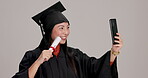 Woman, certificate and university student with selfie in studio for social media post or profile picture. Japanese person, scroll and smile or happy in gray background for graduation or qualification