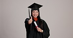 Thumbs up, happy woman or student with graduation diploma, learning goal or success on mockup space. Face, college graduate or Asian person with like hand gesture on white studio background in Taiwan