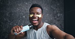 Black man, face and singing in bathroom with skincare, energy and excited for facial treatment. Person, happy and eye patch in home with karaoke, fun morning and anti aging product on skin in Kenya