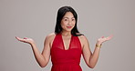 Face, options and woman with hand gesture, decision and model on gray studio background. Portrait, person and lady with choice, expression or comparison with opportunity, questions or doubt with idea