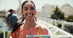 Woman, face and outdoor campus for education, travel and student proud of scholarship. Female person, portrait and confidence at university for learning books, morning and commute to class on bridge