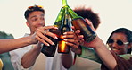 Hands, friends and toast beer at beach, excited and outdoor on vacation with celebration for new years eve. People, men and women with cheers, happy and together for drinks, picnic or party by sea