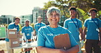Face, group and woman with clipboard, volunteering and teamwork for charity project. Portrait, people and senior person with documents, food donations or unity for non profit, NGO foundation or smile