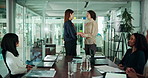 Business women, meeting and handshake with group for presentation, introduction or greeting at office. Female people, employees or colleagues shaking hands with smile for company partnership or b2b