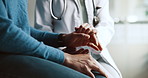 Doctor, patient and holding hands with empathy and support for cancer news and diagnosis. Healthcare, consultation and helping with kindness and advice for chemotherapy and wellness at clinic