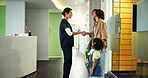 Dentist, handshake and welcome with woman, reception and appointment for checkup. Child healthcare, high five and greeting with girl for dental care, oral hygiene and teeth cleaning service in clinic