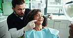 People, dentist and happy with patient on mirror for dental surgery, teeth whitening and treatment at clinic. Female person, male doctor and smile on consultation for canal procedure and oral care&nbsp;
