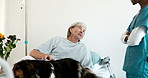 Healthcare, dog and senior patient at facility with nurse for medical consultation with diagnosis. Puppy, relax and elderly woman with pet animal for support in checkup with caregiver in nursing home
