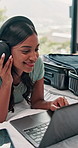 Headphones, laptop and woman in bedroom in home listening to music for online blog review of album. Happy, audio tech and person streaming playlist on computer for creative project in apartment.
