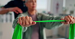 Hands, woman and physiotherapist with fitness band for stretching, wellness and healing for injury. Rehabilitation, senior patient and expert with advice for physiotherapy, arms recovery and exercise