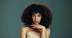 Hair, beauty and face of woman in studio with natural hairstyle, healthy texture and wellness. Curly, salon and portrait of person for cosmetics, keratin and shampoo treatment on green background