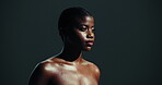Glow, beauty and skincare with black woman in studio for shine, dermatology and aesthetic. Self care, cosmetics and salon with female person on dark background for collagen benefits, wellness and spa