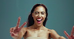 Woman face, peace sign and wink for haircare in studio, color treatment and keratin shampoo results. Female person, portrait and emoji for self love on background, wind and pout for dermatology