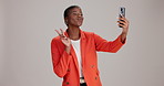 Phone, black woman selfie and peace sign with social media, pout and profile picture. Smartphone, hand gesture and person for online, dating or internet app on grey background studio mockup space