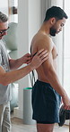 People, training and technology as coach for fitness, wellness and muscle in rehabilitation clinic. Ready, men and exercise as personal trainer for support, endurance test and cardio in physiotherapy