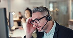 Man, stress and call centre agent in office, difficult client and hotline discussion with consultant. Male person, technical support and internet issue with customer, talking and computer for crisis