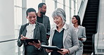 Business people, teamwork and women with tablet, escalator and conversation in office. Employees, financial advisors or accounting with tech, connection or communication with app, help or feedback