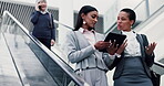 Teamwork, escalator and business women with tablet for mentor, networking and client proposal. Feedback, project management and digital report with employees for advisor, planning and discussion