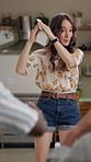 Happy, charades and woman in home at games night in home with friends for entertainment. Fun, bonding and female person playing acting pantomime for party together in living room at apartment.