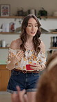 Acting, girl and playing game in home with action description, answer clues and explain with energy. Entertainment, woman and card for challenge, excited and mime activity for competition and bonding