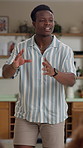 Happy, charades and man in home at games night in home with friends for entertainment. Fun, bonding and African male person playing acting pantomime for party together in living room at apartment.