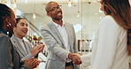 Group clapping, shaking hands and business man with respect, praise and celebrate success in office. Smile, team handshake and applause for promotion, congratulations and reward for goal achievement