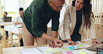Teamwork, colleagues and discussion for project, choice and planning for interior design and talking. Office, collaboration and people with documents for decision, ideas and organizing on desk